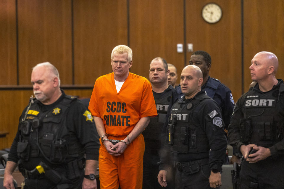 Alex Murdaugh, second from left, is brought out into the courtroom during a jury-tampering hearing at the Richland County Judicial Center, Monday, Jan. 29, 2024, in Columbia, S.C. (Andrew J. Whitaker/The Post And Courier via AP, Pool)