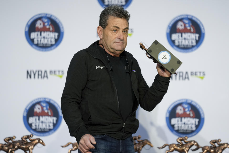 Assistant trainer Jimmy Barnes randomly selects fourth position for the entrant National Treasure during a drawing for post positions ahead of the Belmont Stakes horse race, Tuesday, June 6, 2023, at Belmont Park in Elmont, N.Y. (AP Photo/John Minchillo)