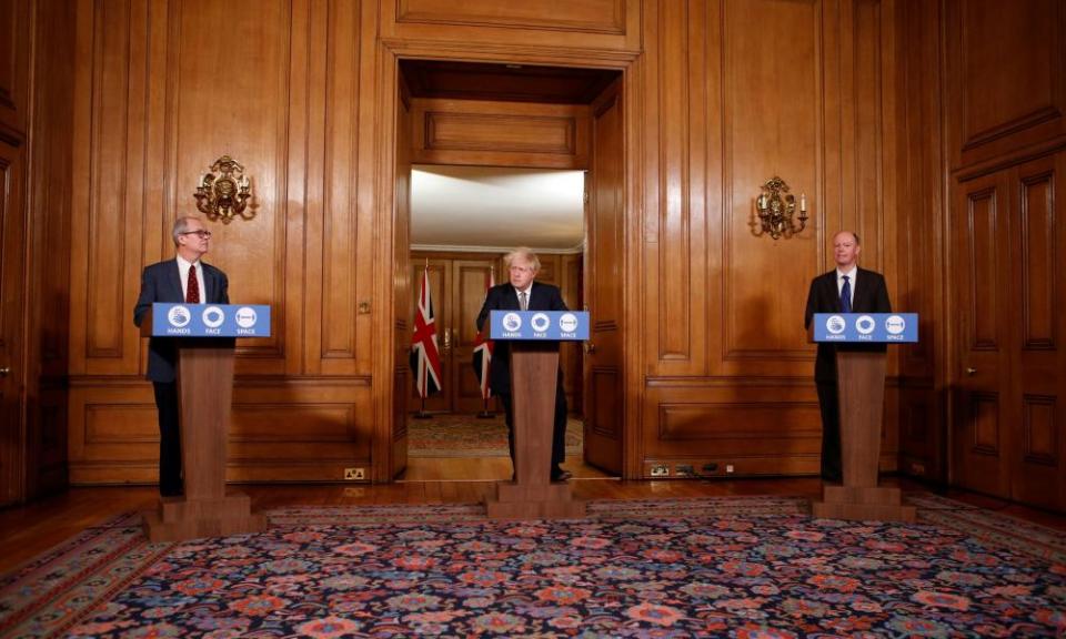 Prime minister Boris Johnson alongside chief medical officer Chris Whitty and chief scientific adviser Patrick Vallance, at a news conference on Covid-19 on 26 November.