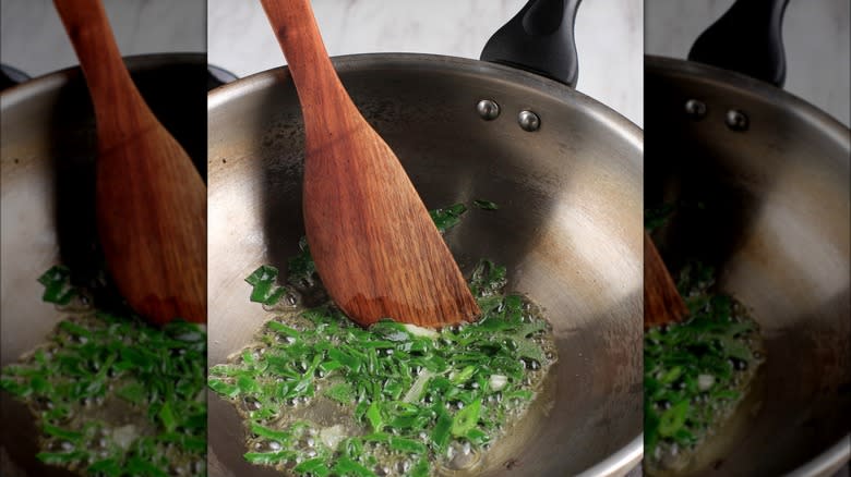 green onions frying in wok