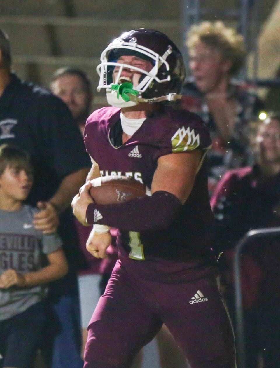 MAddax Fayard celebrates a touchdown as Niceville hosts North Miami in the season home opener.