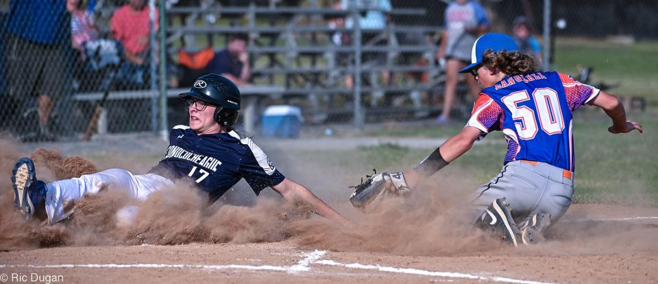 Conococheague's Zeke Wilson slides safely across home plate as Talbot pitcher Jordan Langfell attempts the tag during Conococheague's 13-8 win in the Junior League state tournament.
