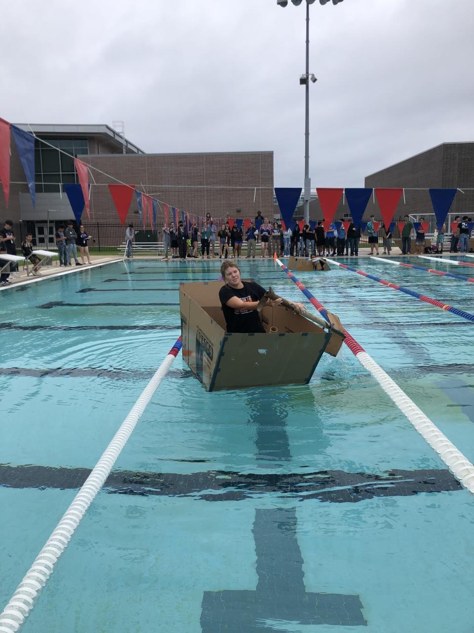 A boat being paddled in the middle of a pool. Photo courtesy of Tyler ISD.