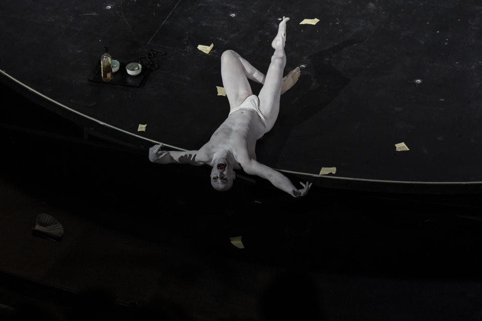 An actor participates a performance of "Madame Butterfly" at the Odeon of Herodes Atticus in Athens, on Thursday, June 1, 2023. The annual arts festival in Athens and at the ancient theater of Epidaurus in southern Greece is dedicated this year to the late opera great Maria Callas who was born 100 years ago. (AP Photo/Petros Giannakouris)