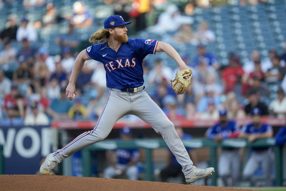 Texas Rangers starting pitcher Jon Gray throws during the first inning of a baseball game against the Los Angeles Angels, Monday, July 8, 2024, in Anaheim, Calif. (AP Photo/Ryan Sun)