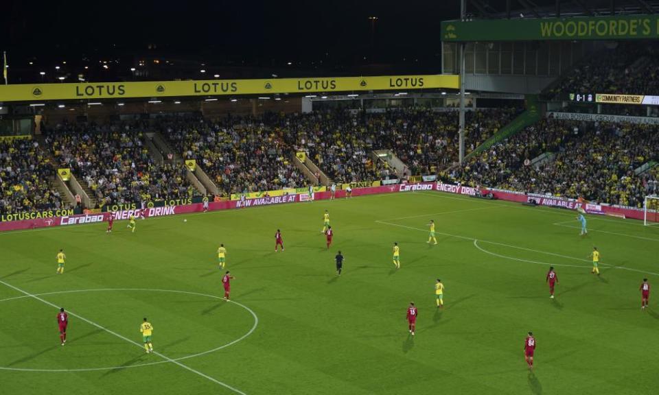 Norwich line up with a three-man defence against Liverpool in midweek