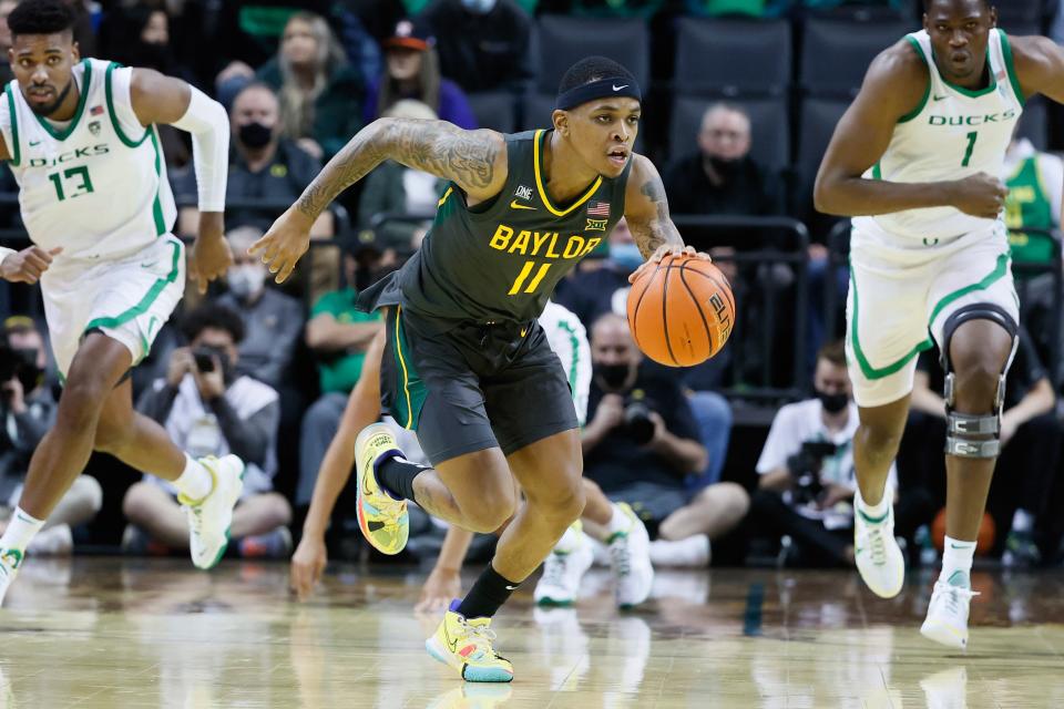 Baylor guard James Akinjo (11) dribbles the ball on a fast break against Oregon during the second half at Matthew Knight Arena.