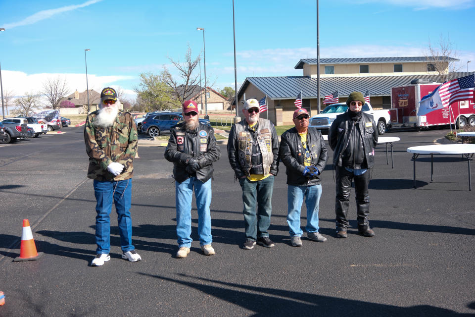 Veterans stand at the opening ceremony for the Vietnam Traveling Memorial Wall Wednesday at the Ussery-Roan Texas State Veterans Home in Amarillo.