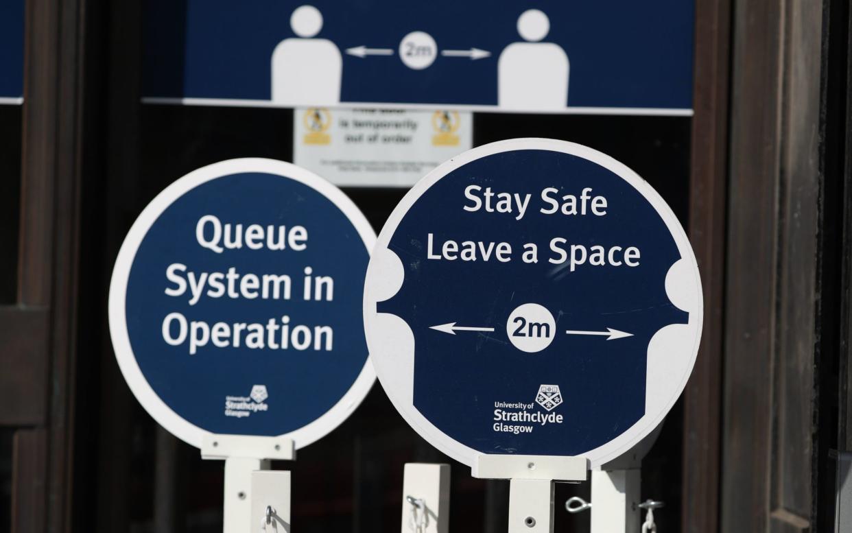 Social distancing signage in place at the entrance to the University of Strathclyde, Glasgow -  Andrew Milligan/PA