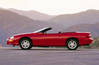 <p>For the fourth incarnation of the Camaro sports car line, Chevy produced a design which looked like it had been squeezed from a tube. Long and sleek it certainly was, but the wheelbase looked comedically lost. Curiously, while the mid-life 1998 model facelift, with its more upright grille and bolder, peanut-shaped headlights, redressed that a little in visual terms, the new front clip <strong>actually made the Camaro a tad longer</strong> at 4915mm, reducing the wheelbase quotient to <strong>52.25%</strong>.</p><p>Still, it wasn’t all bad becoming the least expensive way to get into V8 ownership – using the Corvette’s 5.7-litre LS1 unit, no less – when GM officially began UK imports before the end of the 1990s. Shame it remained left-hand drive, though. While we’re Camaro-ing, the third-generation also gets a shout-out, thanks to its late-in-life makeover giving it a <strong>52.45%</strong> score.</p>