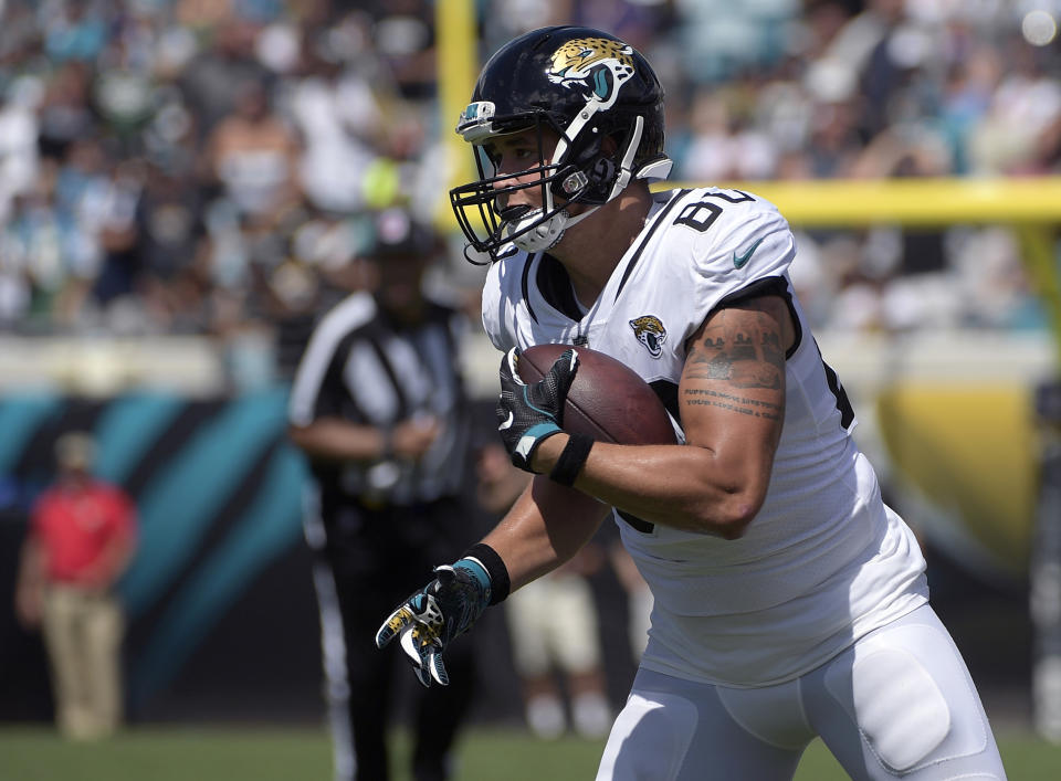 FILE - In this Sept. 30, 2018, file photo, Jacksonville Jaguars tight end James O'Shaughnessy (80) runs after catching a pass during the first half of an NFL football game against the New York Jets in Jacksonville, Fla. Veteran tight end has re-signed with the Jacksonville Jaguars, giving the team another option at one of its thinnest positions. (AP Photo/Phelan M. Ebenhack, File)