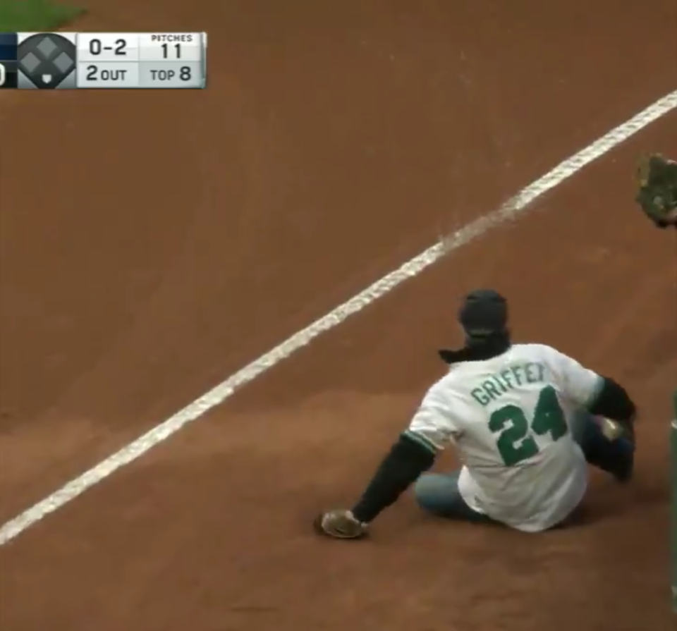 A Seattle Mariners fan fell onto the field Wednesday at AT&T Park while trying to catch a foul ball. (MLB/screen grab)