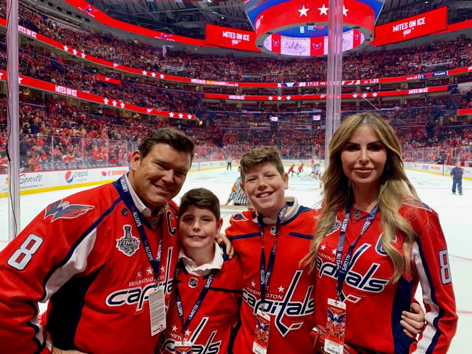 The Baiers: Bret, Daniel, Paul and Amy root on their home team at a Washington Capitals hockey game.