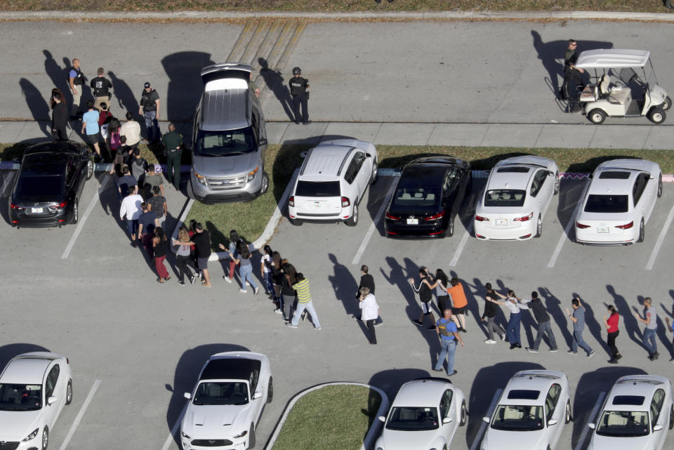 Students are evacuated by police out of Marjorie Stoneman Douglas High School in Parkland, Fla. Photo: Mike Stocker/South Florida Sun Sentinel