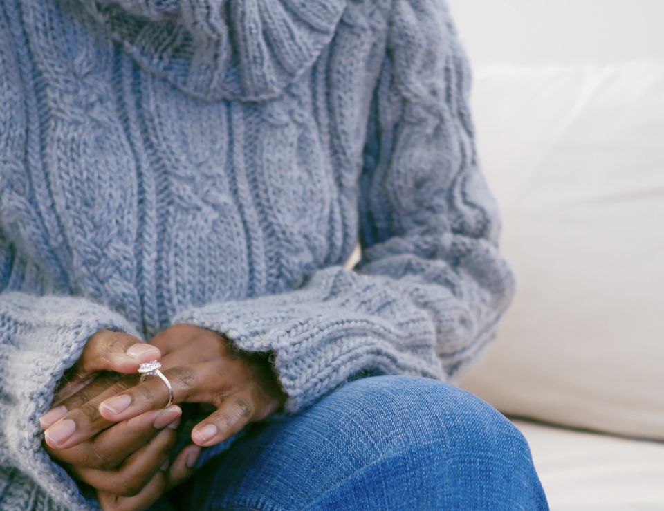 woman removes ring from her finger