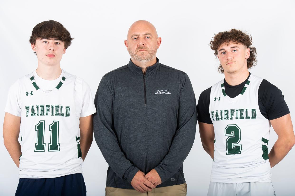 Fairfield basketball head coach Andy Winebrenner poses for a photo with senior Wyatt Kuhn (11) and junior Jayden Bell (2) during YAIAA winter sports media days Thursday, November 9, 2023, in York.