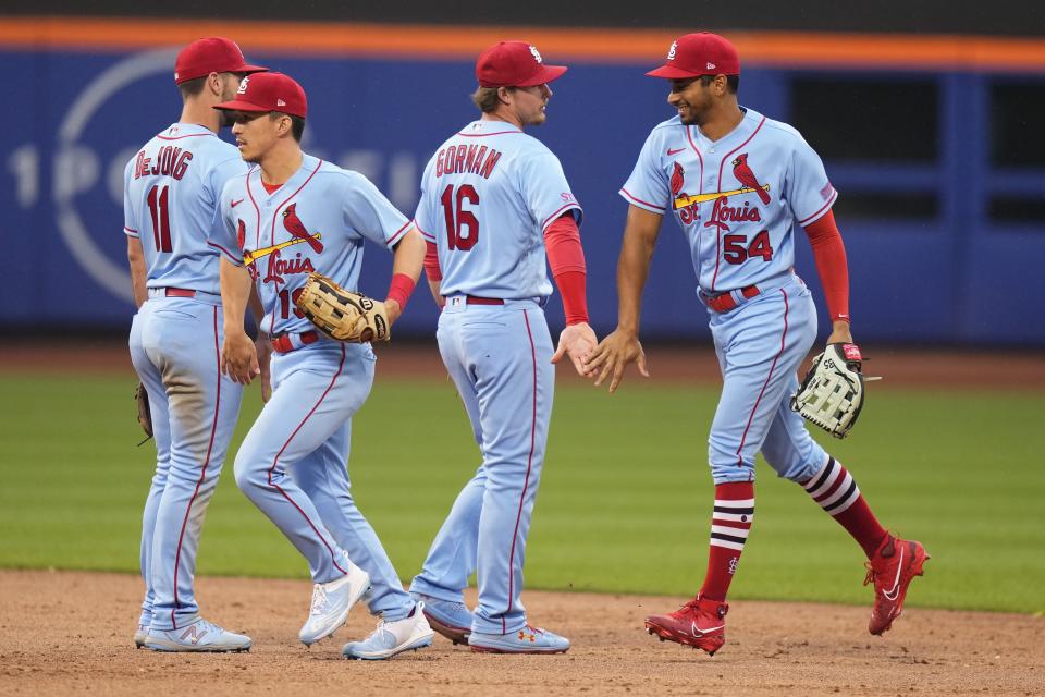 St. Louis Cardinals' Oscar Mercado (54) celebrates with Nolan Gorman (16), Tommy Edman (19) and Paul DeJong (11) after the team's win in a baseball game against the New York Mets on Saturday, June 17, 2023, in New York. (AP Photo/Frank Franklin II)