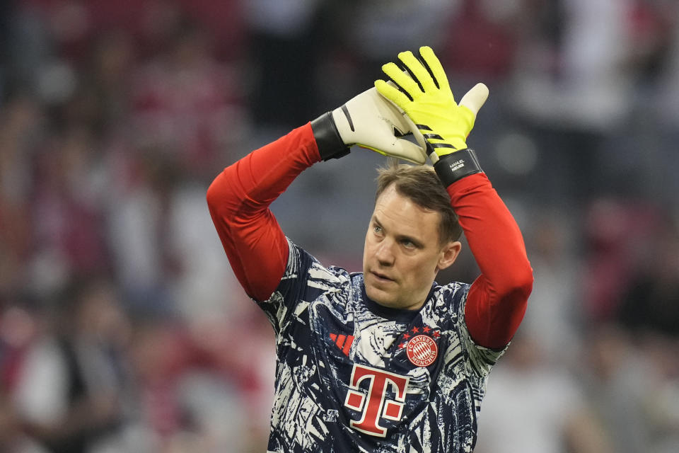 Bayern's goalkeeper Manuel Neuer applauds fans as he warms up prior to the Champions League semifinal first leg soccer match between Bayern Munich and Real Madrid at the Allianz Arena in Munich, Germany, Tuesday, April 30, 2024. (AP Photo/Matthias Schrader)