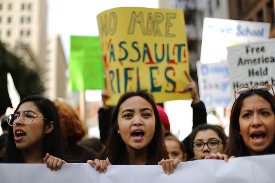 <p>Young activists chant before marching in Los Angeles. (Photo: Getty Images) </p>