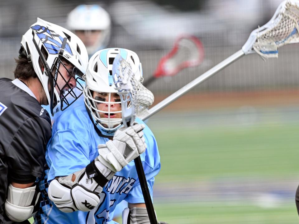 WORCESTER  6/22/22 Caleb Richardson  of  Sandwich attempts to get past Tristen Sheldon of Wahconah Regional  in the  boys Division 4 Final lacrosse match.