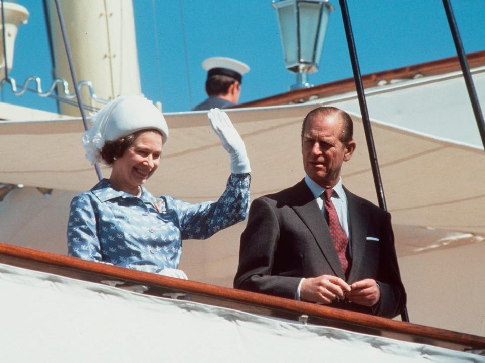 The Queen And Prince Philip waving on board the Royal Yacht Britannia during an official visit to Kuwait during the tour of the Gulf in 1979.