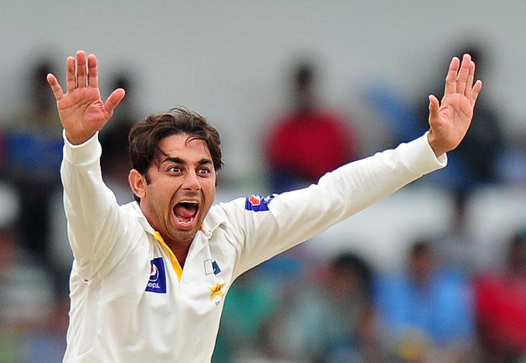 Top Pakistani off-spinner Saeed Ajmal successfully appeals for a wicket during the fourth day of the second Test in Colombo on August 17, 2014