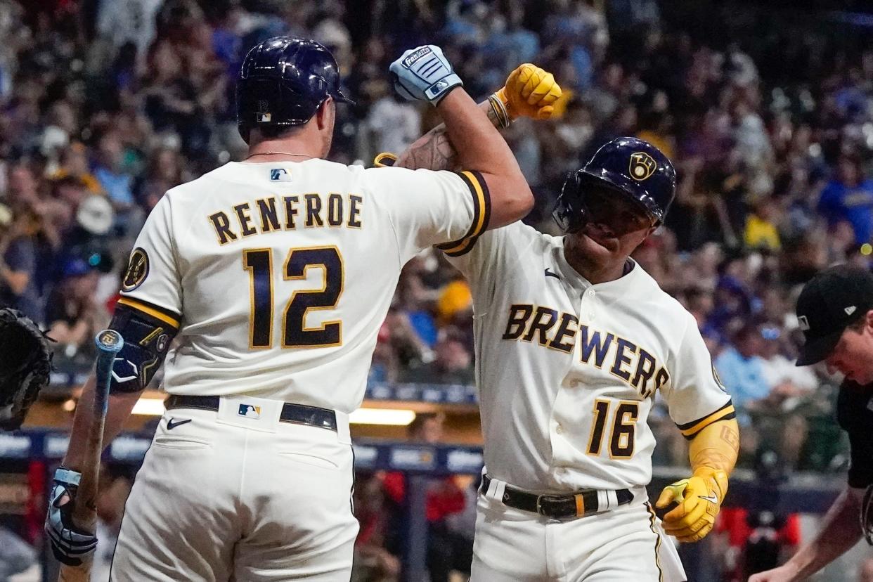 Brewers second baseman Kolten Wong gets a forearm smash from Hunter Renfroe after hitting a game-tying  solo home run against the Twins in the sixth inning Tuesday night. Renfroe had a three-run shot earlier in the game.