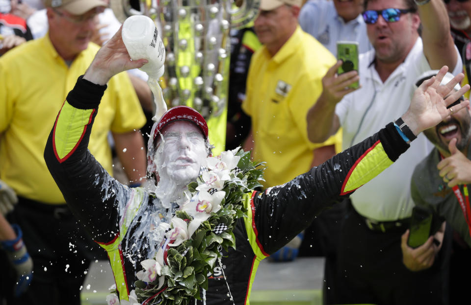 FILE - This May 26, 2019, file photo shows Simon Pagenaud, of France, celebrating after winning the Indianapolis 500 IndyCar auto race at Indianapolis Motor Speedway, in Indianapolis. The Indy 500 has been rescheduled for Aug. 23, 2020, and won't be run on Memorial Day weekend as scheduled for the first time since its return in 1946. Pagenaud passed Alexander Rossi on the penultimate lap to win last May. That gave Roger Penske his 18th win at Indy on the 50th anniversary of his arrival at the Brickyard and before he became the series and track owner. (AP Photo/Michael Conroy, File)