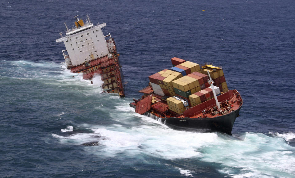 In this Jan. 9, 2012 file photo provided by Maritime New Zealand, the cargo ship Rena is split in two and sits on a reef near Tauranga, New Zealand. The captain and the navigating officer of the ship that ran aground on the reef last year pleaded guilty Wednesday, Feb. 29, 2012 to a series of charges. (AP Photo/Maritime New Zealand, File) EDITORIAL USE ONLY