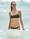 <p>Alessandra Ambrosio hits the water to exercise at the beach in Brazil on Tuesday.</p>