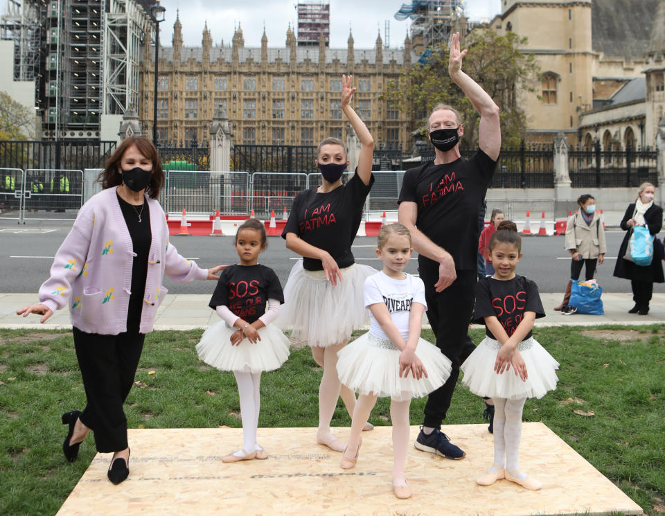 Arlene Phillips (left) joins in with a group of dancers as they perform during a protest calling for more funding for the performing arts in Parliament Square, London.