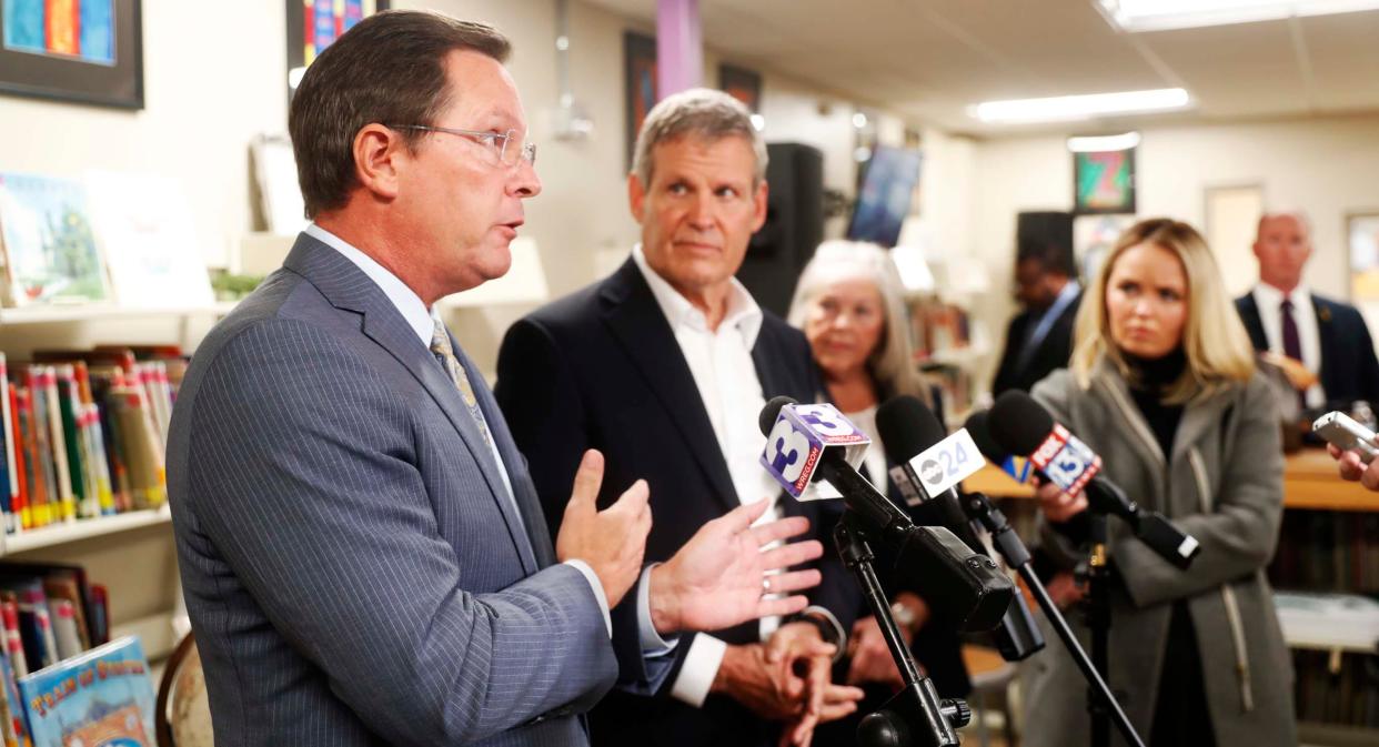 Speaker Cameron Sexton, left, stands next to Governor Bill Lee, right, as he answers a question from the media about school vouchers after a panel consisting of parents, the head of New Hope Christian Academy, and Speaker Cameron Sexton on Wednesday, December 13, 2023 at the New Hope Christian Academy library in Memphis, Tenn.