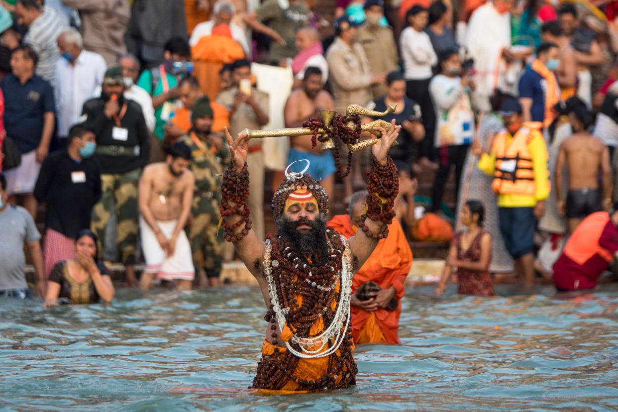 TOPSHOT - A Sadhu bathes in the Ganges river during the ongoing religious Kumbh Mela festival in Haridwar on April 12, 2021. (Photo by Xavier GALIANA / AFP) (Photo by XAVIER GALIANA/AFP via Getty Images)
