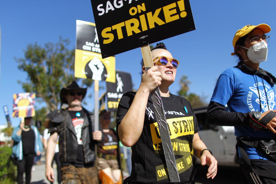 LOS ANGELES, CALIFORNIA - NOVEMBER 08: SAG-AFTRA members and supporters picket outside Netflix studios on day 118 of their strike against the Hollywood studios on November 8, 2023 in Los Angeles, California. Contract negotiations between the actors union and the Alliance of Motion Picture and Television Producers (AMPTP) have inched closer to a deal, with a reported breakthrough on the use of artificial intelligence (AI), in the strike which began on July 14. (Photo by Mario Tama/Getty Images)