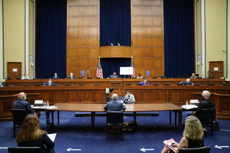 Robert Redfield, director of the Centers for Disease Control and Prevention (CDC), left, Dr. Anthony Fauci, director of the National Institute of Allergy and Infectious Diseases, center, and Admiral Brett Giroir, U.S. assistant secretary for health, right, testify during a House Select Subcommittee hearing on the Coronavirus, Friday, July 31, 2020 on Capitol Hill in Washington. (Erin Scott/Pool via AP)