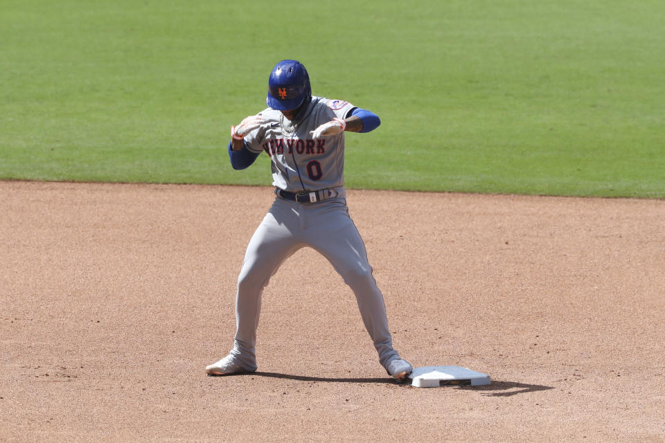 New York Mets' Marcus Stroman dances at second base after hitting a RBI double off San Diego Padres relief pitcher Craig Stammen in the seventh inning of a baseball game Sunday, June 6, 2021, in San Diego. Jose Peraza scored on the play. (AP Photo/Derrick Tuskan)