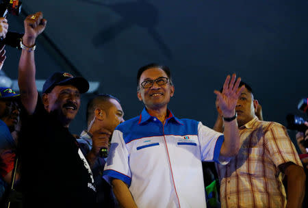 Malaysian politician Anwar Ibrahim, who was granted a royal pardon, arrives to speak to supporters in Kuala Lumpur, Malaysia May 16, 2018. REUTERS/Lai Seng Sin