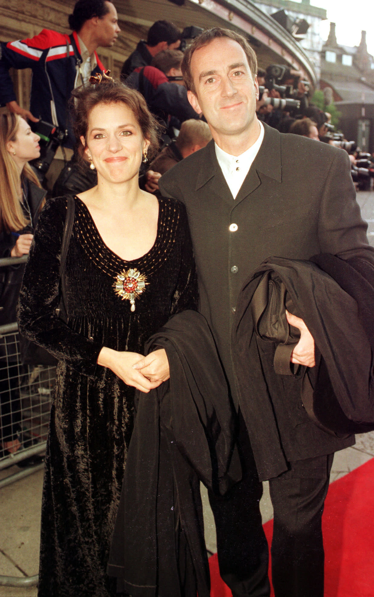 TV presenter Angus Deayton and his partner Lise Meyer arrive at the Royal Albert Hall for the BAFTA award ceremony.