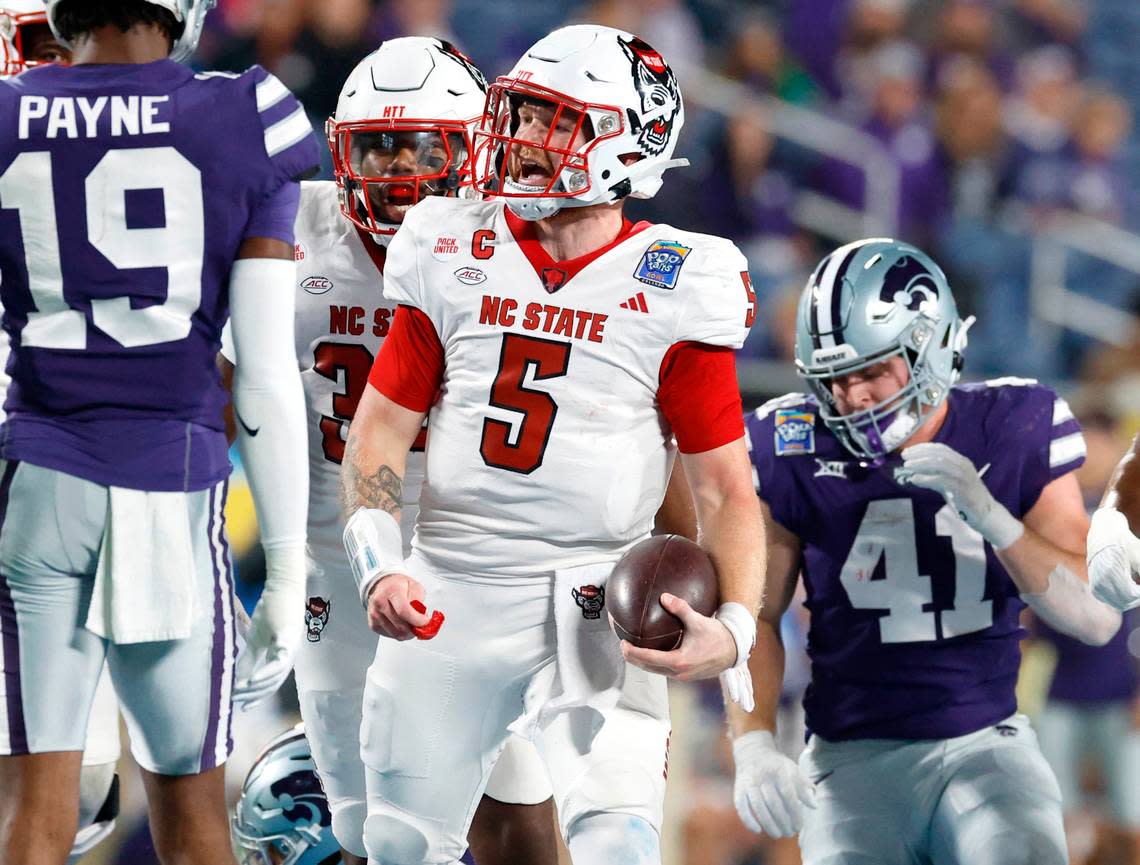 DUPLICATE***N.C. State defensive tackle C.J. Clark (5)***N.C. State quarterback Brennan Armstrong (5) celebrates after a long run during the first half of N.C. State’s game against Kansas State in the Pop-Tarts Bowl at Camping World Stadium in Orlando, Fla., Thursday, Dec. 28, 2023. Ethan Hyman/ehyman@newsobserver.com