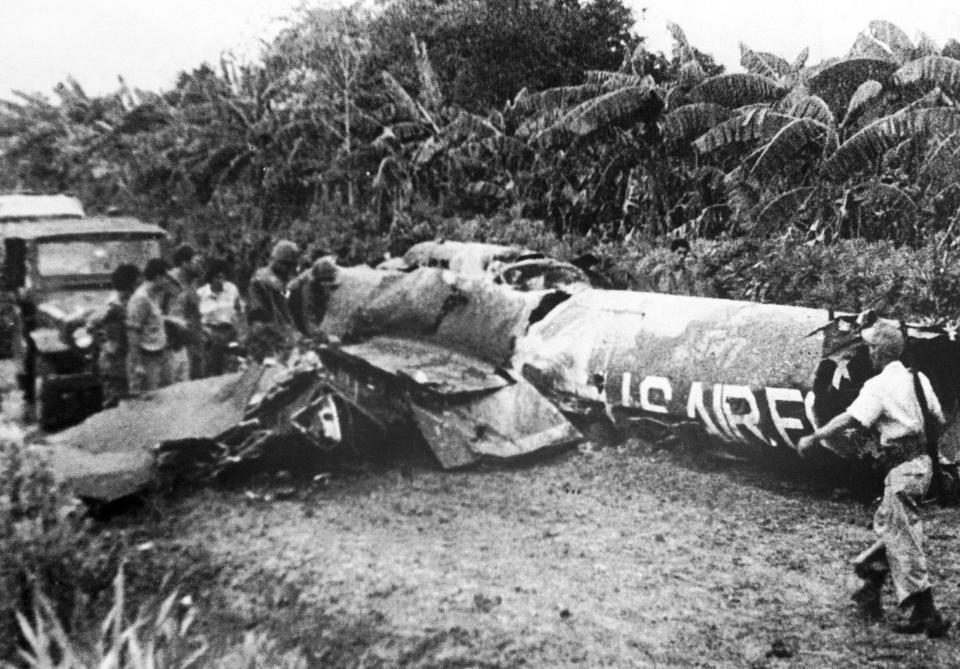 The debris of an American U-2 airplane shot down by the Cubans during the 1962 missile crisis is scattered over the ground.