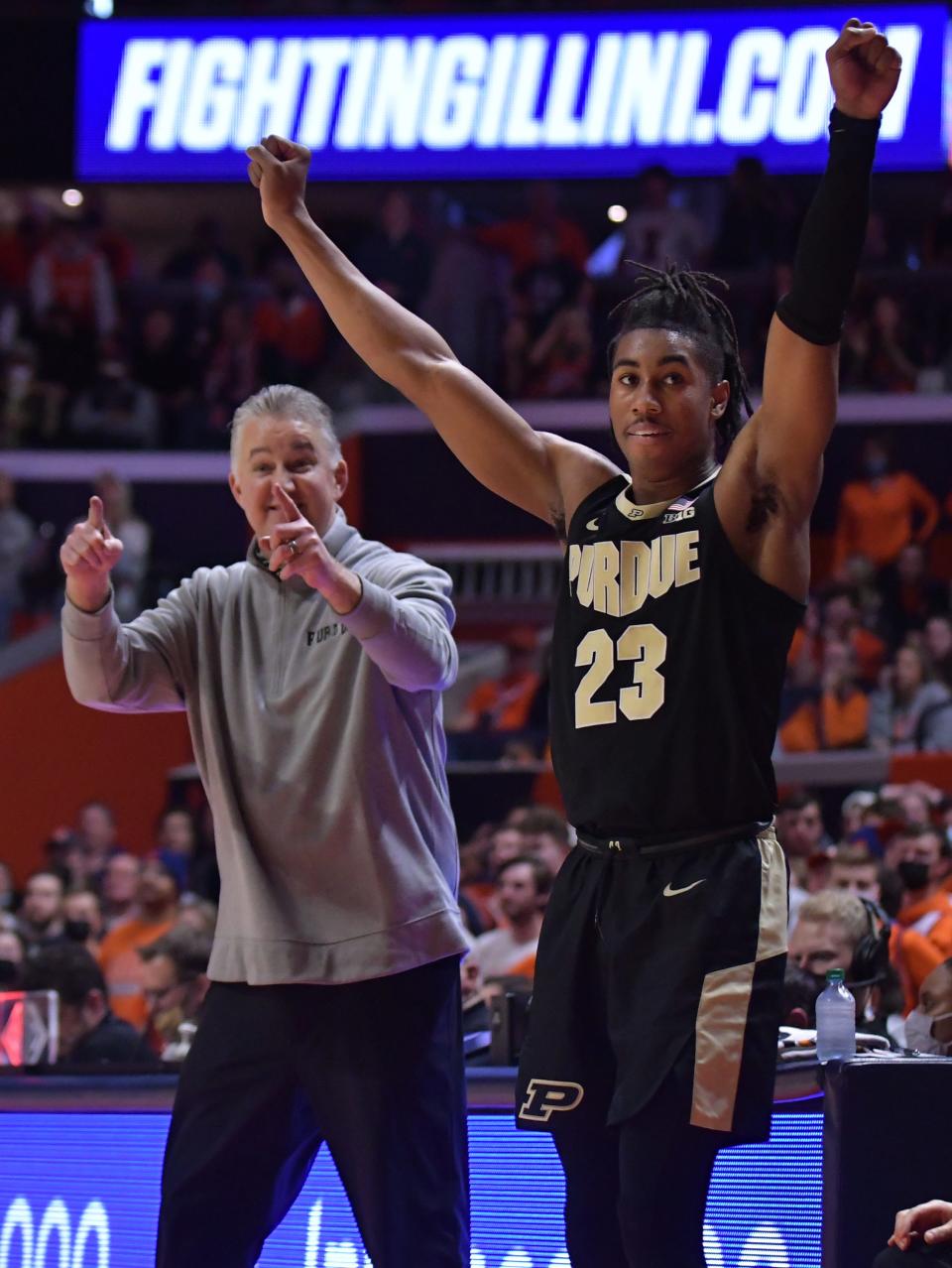 Purdue Boilermakers head coach Matt Painter and player Jaden Ivey (23) celebrate a score during the second half against the Illinois Fighting Illini at State Farm Center.