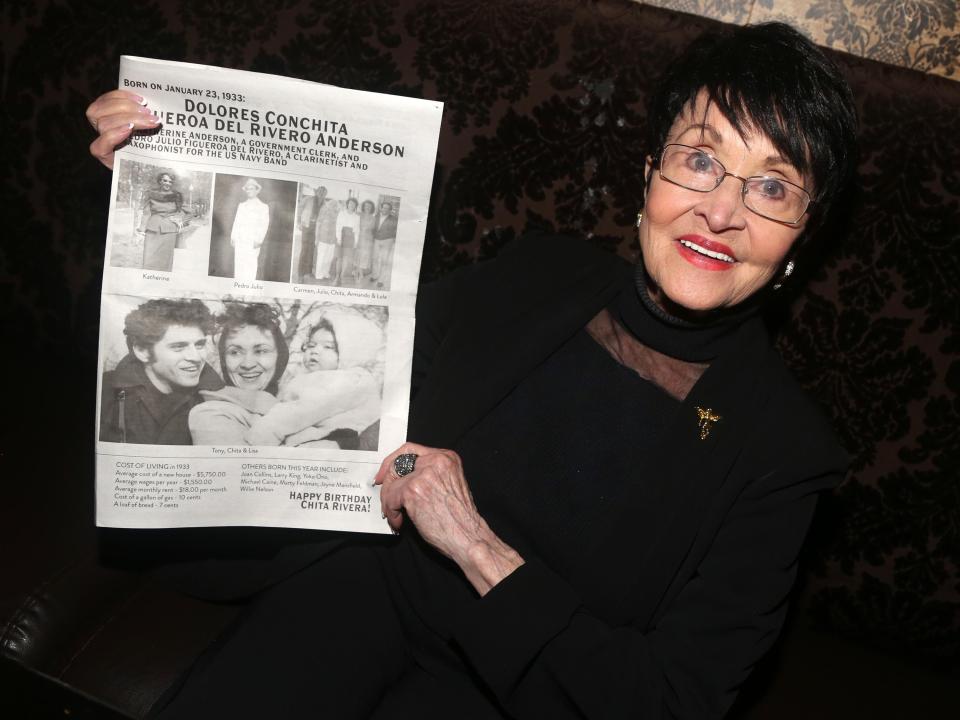 Chita Rivera poses with a newspaper specially printed for her birthday at Chita Rivera's 90th Birthday Celebration at Bathtub Gin on January 23, 2023 in New York City.