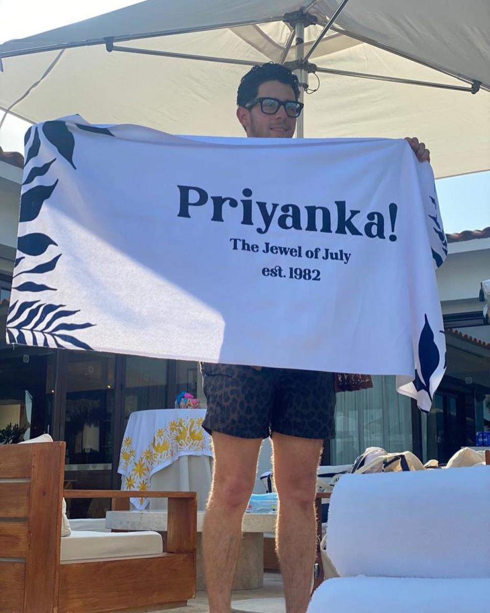 Nick Jonas held up a towel declaring Priyanka Chopra the ‘Jewel of July’ (Nick Jonas / Instagram)