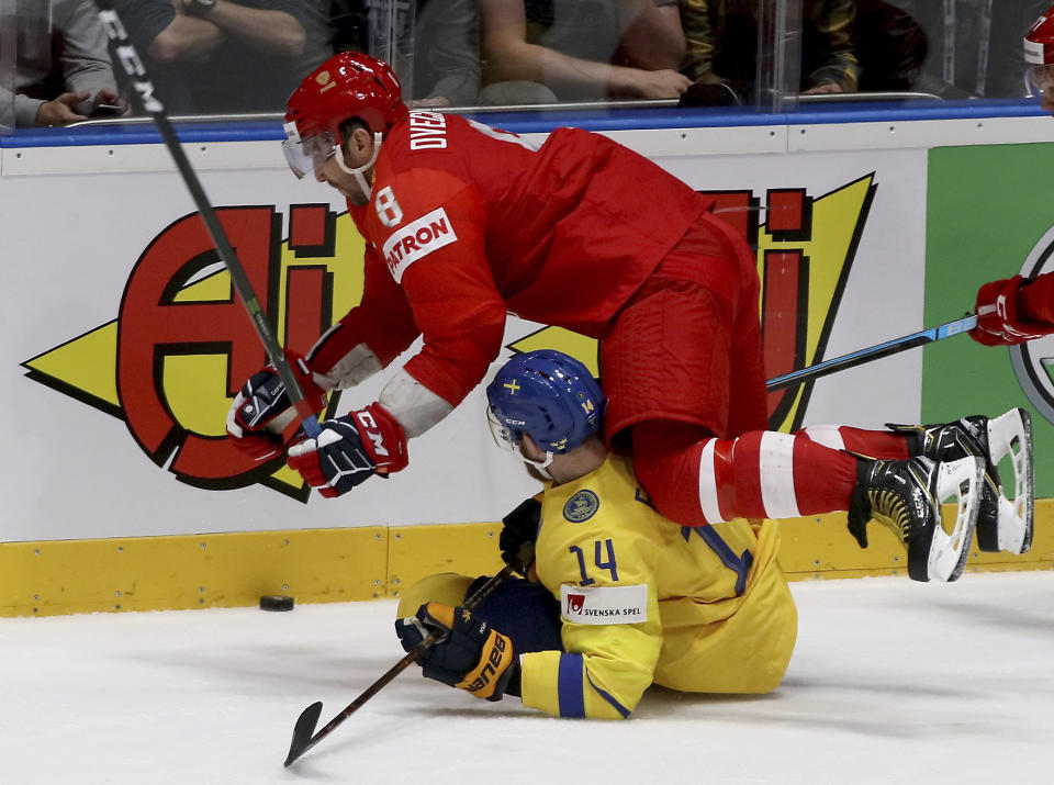 Russia's Alexander Ovechkin checks Sweden's Mattias Ekholm, from left, during the Ice Hockey World Championships group B match between Sweden and Russia at the Ondrej Nepela Arena in Bratislava, Slovakia, Tuesday, May 21, 2019. (AP Photo/Ronald Zak)