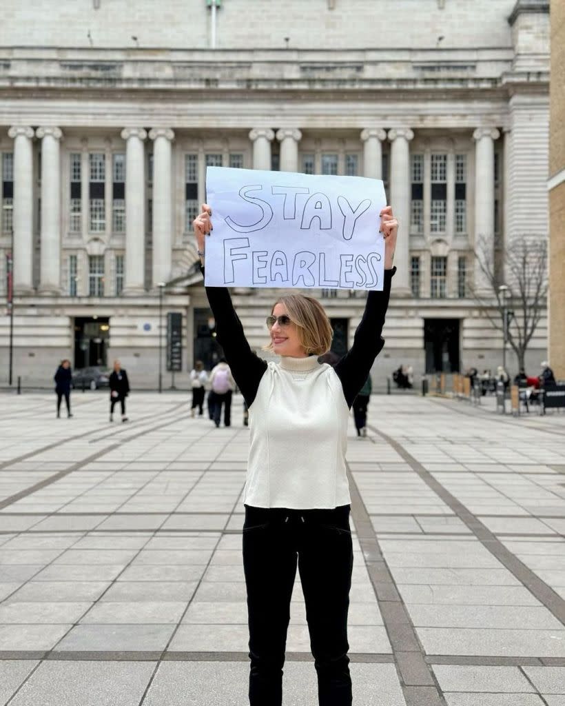 “When people ask me what being fearless is, it’s like asking security where the race starts and where it ends,” she wrote Sunday on X about the NYCRUNS Brooklyn Half Marathon. Here, Curtis holds a “stay fearless” sign, a nod to her brand. Instagram/@alexa_curtis