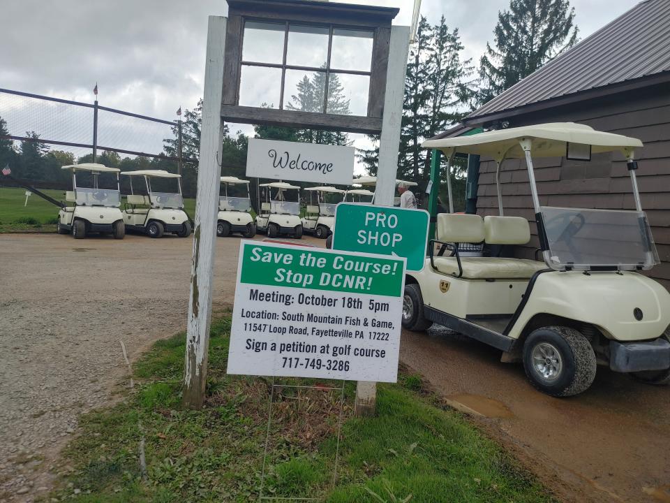 A sign at South Mountain Golf Course advertises a public meeting to "Save the Course! Stop DCNR!" The meeting will be at 5 p.m. Oct. 18 at South Mountain Fish and Game Club.