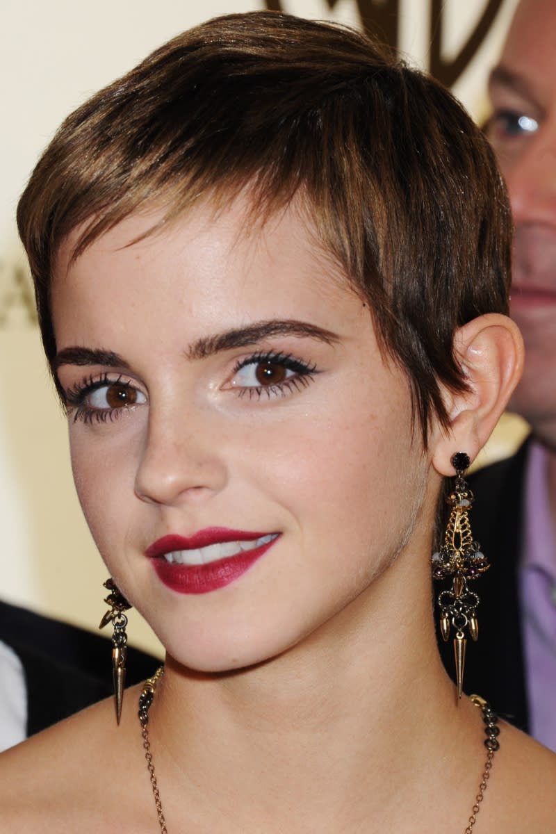 Emma Watson has a short pixie cut as she  attends the reception to celebrate the new Warner Brothers Leavesden Studios at Claridge's on November 10, 2010 in London, England.