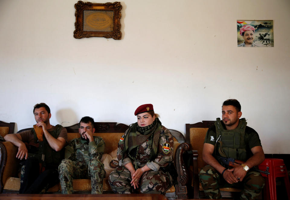 Nauzad sits with other fighters&nbsp;in Nawaran.