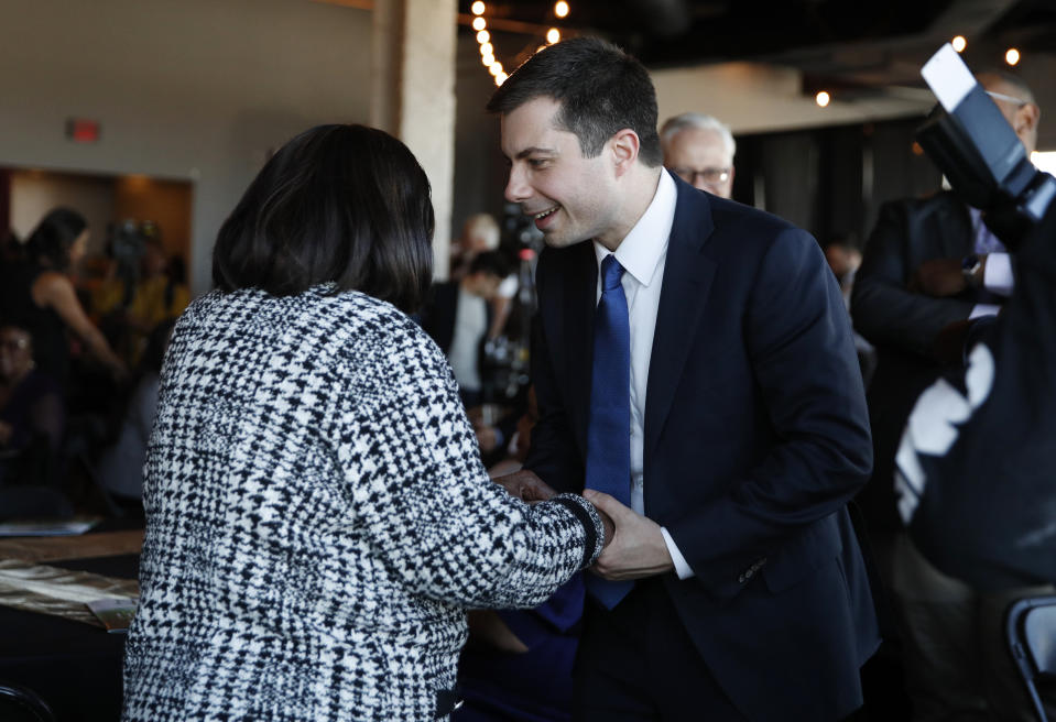 Democratic presidential candidate former South Bend Mayor Pete Buttigieg meets with people at the Nevada Black Legislative Caucus Black History Awards brunch Sunday, Feb. 16, 2020, in Las Vegas. (AP Photo/John Locher)