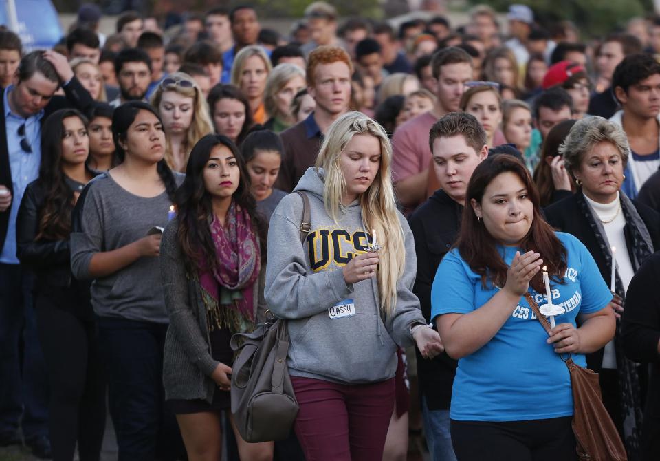 UC Santa Barbara students attend a candlelight vigil following Friday's series of drive-by shootings in Isla Vista